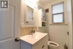 Bathroom with tasteful backsplash and vanity - 