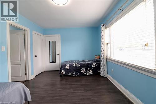 Bedroom with dark wood finished floors and a closet - 80 Roseview Avenue, Cambridge, ON - Indoor Photo Showing Bedroom