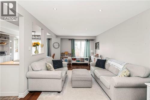 Living room with dark wood-style flooring and recessed lighting - 311 Highway 8 Unit# 12, Stoney Creek, ON - Indoor Photo Showing Living Room