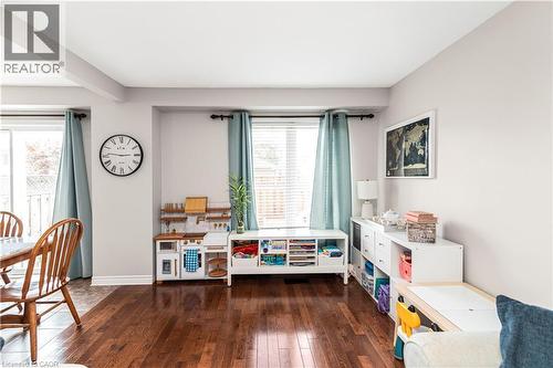 Game room featuring dark wood-style flooring and baseboards - 311 Highway 8 Unit# 12, Stoney Creek, ON - Indoor