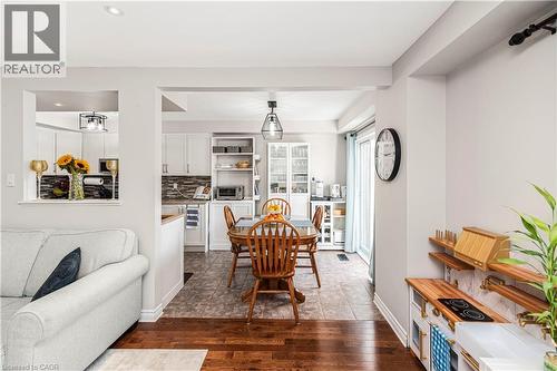 Dining area featuring dark wood-type flooring and recessed lighting - 311 Highway 8 Unit# 12, Stoney Creek, ON - Indoor