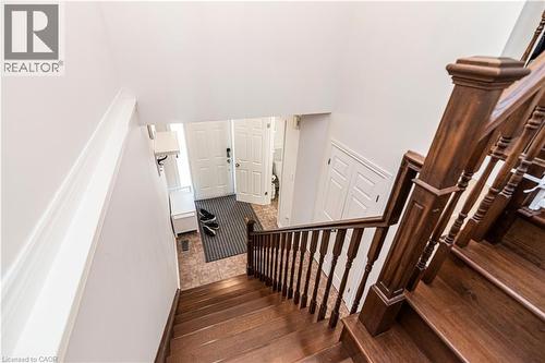 Stairs featuring hardwood / wood-style floors and a high ceiling - 311 Highway 8 Unit# 12, Stoney Creek, ON - Indoor Photo Showing Other Room