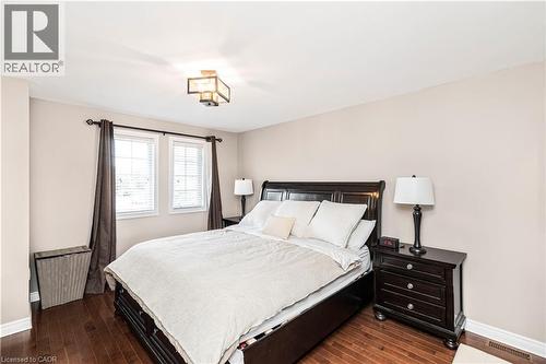 Bedroom featuring baseboards and dark wood-style floors - 311 Highway 8 Unit# 12, Stoney Creek, ON - Indoor Photo Showing Bedroom