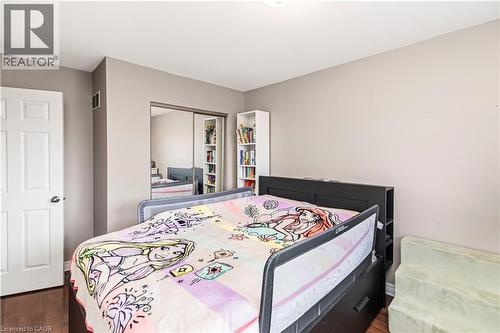 Bedroom featuring a closet and dark wood-style floors - 311 Highway 8 Unit# 12, Stoney Creek, ON - Indoor Photo Showing Bedroom