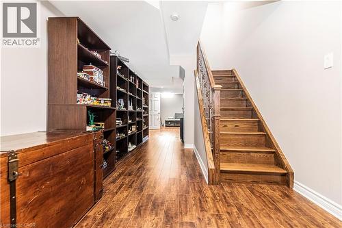 Stairs with hardwood / wood-style flooring and baseboards - 311 Highway 8 Unit# 12, Stoney Creek, ON - Indoor Photo Showing Other Room