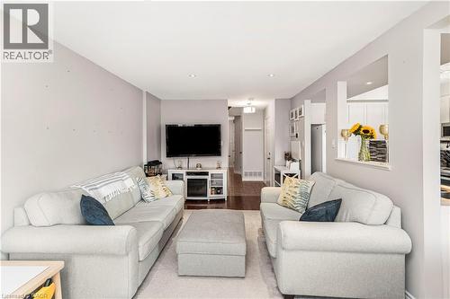 Living room with wood finished floors - 311 Highway 8 Unit# 12, Stoney Creek, ON - Indoor Photo Showing Living Room