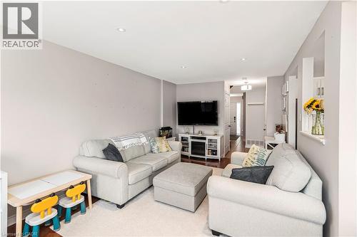 Living room with wood finished floors - 311 Highway 8 Unit# 12, Stoney Creek, ON - Indoor Photo Showing Living Room