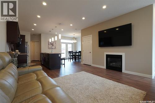 4125 Green Olive Way E, Regina, SK - Indoor Photo Showing Living Room With Fireplace