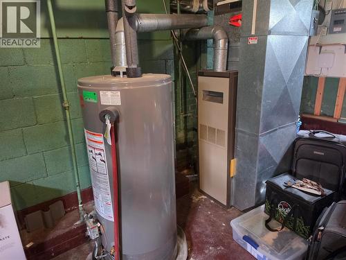 Gas furnace and hot water tank - 804 Eighth Street, Nelson, BC - Indoor Photo Showing Basement