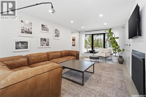 3610 Balfour Court, Saskatoon, SK - Indoor Photo Showing Living Room With Fireplace
