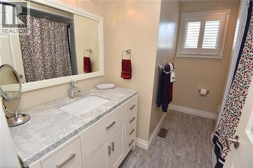 Full bathroom with vanity, a shower with shower curtain, and light wood-style flooring - 2206 Donald Road, Burlington, ON - Indoor Photo Showing Bathroom