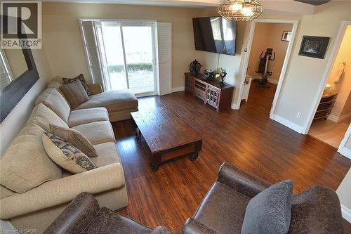 Living room with dark wood-style flooring and baseboards - 2206 Donald Road, Burlington, ON - Indoor Photo Showing Living Room