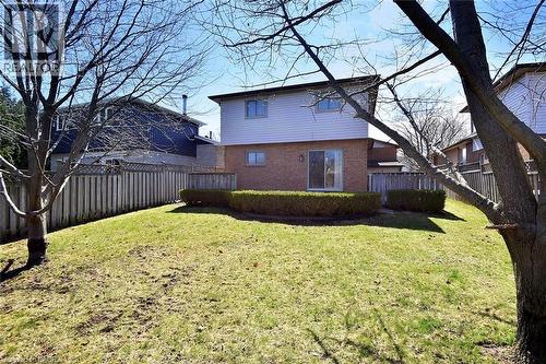 Back of house with brick siding and a fenced backyard - 2206 Donald Road, Burlington, ON - Outdoor