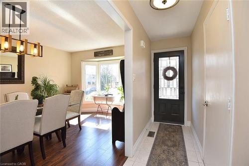 Entryway featuring healthy amount of natural light, hanging lights, and light tile patterned floors - 2206 Donald Road, Burlington, ON - Indoor