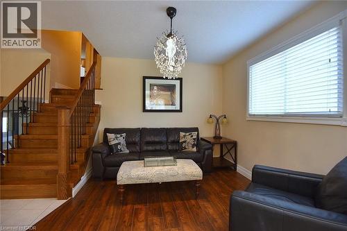 Living area with hanging lights and hardwood / wood-style flooring - 2206 Donald Road, Burlington, ON - Indoor Photo Showing Living Room