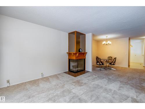 108 Forest Gv, St. Albert, AB - Indoor Photo Showing Other Room With Fireplace