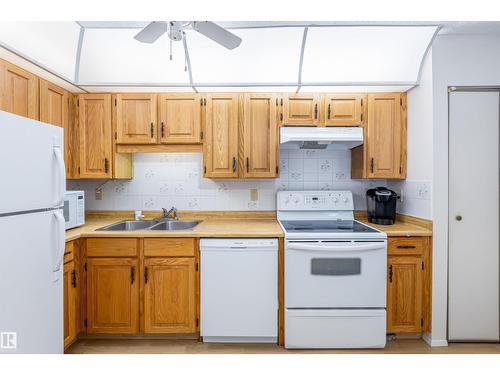 108 Forest Gv, St. Albert, AB - Indoor Photo Showing Kitchen With Double Sink