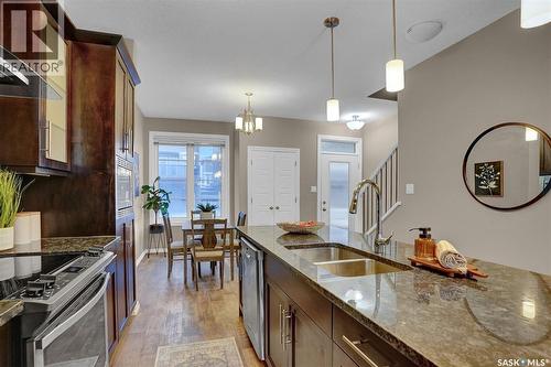 124 3229 Elgaard Drive, Regina, SK - Indoor Photo Showing Kitchen With Double Sink With Upgraded Kitchen