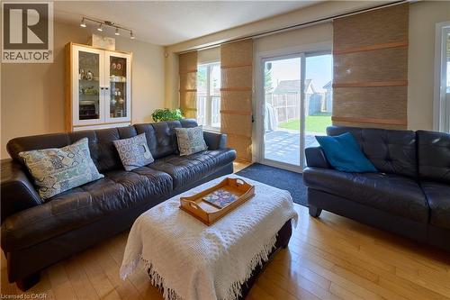 Living room featuring light wood-type flooring and a textured ceiling - 126 Snowdrop Crescent, Kitchener, ON - Indoor Photo Showing Living Room