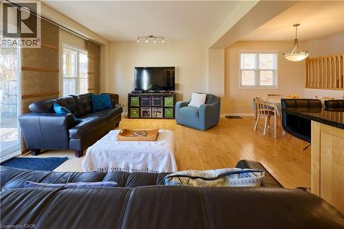 Living area featuring light wood-style flooring and baseboards - 126 Snowdrop Crescent, Kitchener, ON - Indoor Photo Showing Living Room