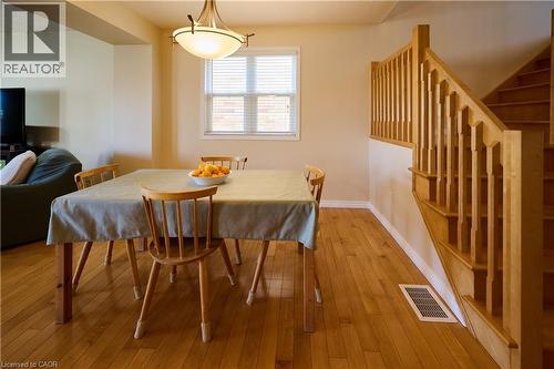 Dining area featuring hardwood / wood-style floors and baseboards - 126 Snowdrop Crescent, Kitchener, ON - Indoor Photo Showing Dining Room