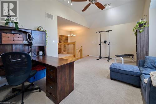 Home office with light colored carpet, ceiling fan, hanging lights, and lofted ceiling - 126 Snowdrop Crescent, Kitchener, ON - Indoor Photo Showing Office