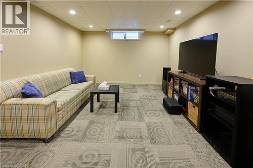 Living area with light colored carpet, recessed lighting, and a paneled ceiling - 126 Snowdrop Crescent, Kitchener, ON - Indoor Photo Showing Basement