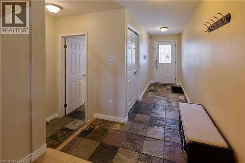 Doorway with stone tile floors and a textured ceiling - 126 Snowdrop Crescent, Kitchener, ON - Indoor Photo Showing Other Room