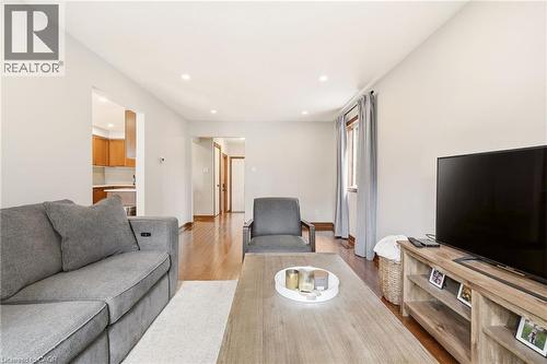 The living area features hardwood floors and recessed lighting, offering a bright and open atmosphere - 1 Tomahawk Drive, Grimsby, ON - Indoor Photo Showing Living Room