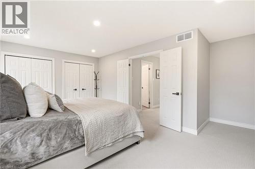 This room features light grey walls, light-colored carpeting, and recessed lighting - 1 Tomahawk Drive, Grimsby, ON - Indoor Photo Showing Bedroom
