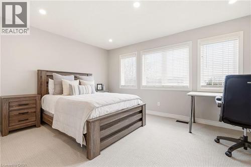 This room features light-colored walls, recessed lighting, and windows with blinds - 1 Tomahawk Drive, Grimsby, ON - Indoor Photo Showing Bedroom