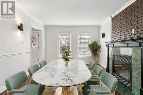 4 Burt Drive, Brampton, ON - Indoor Photo Showing Dining Room With Fireplace