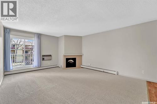 202B 1121 Mckercher Drive, Saskatoon, SK - Indoor With Fireplace
