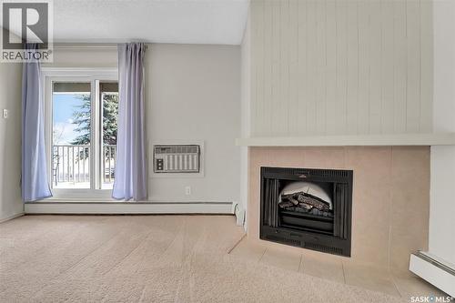 202B 1121 Mckercher Drive, Saskatoon, SK - Indoor Photo Showing Living Room With Fireplace