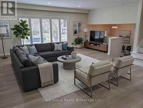 virtually staged living room - 165 Brookside Crescent, Kitchener, ON - Indoor Photo Showing Living Room With Fireplace