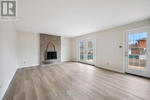 family room - 165 Brookside Crescent, Kitchener, ON - Indoor Photo Showing Living Room With Fireplace