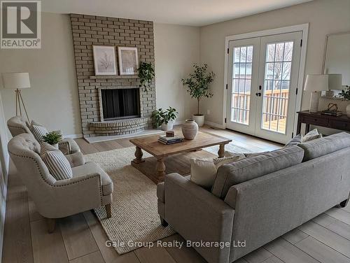 virtually staged family room - 165 Brookside Crescent, Kitchener, ON - Indoor Photo Showing Living Room With Fireplace