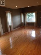 Spare room featuring light wood finished floors - 