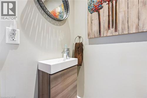 The property features a modern vanity with a white rectangular sink and a toilet - 155 Lancaster Street E, Kitchener, ON - Indoor Photo Showing Bathroom