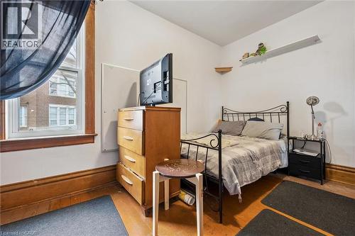 This room features hardwood floors and a window with natural light - 155 Lancaster Street E, Kitchener, ON - Indoor Photo Showing Bedroom