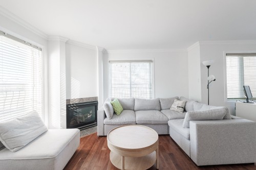 Living Room - 302-6535 Boul. Chevrier, Brossard, QC - Indoor Photo Showing Living Room With Fireplace