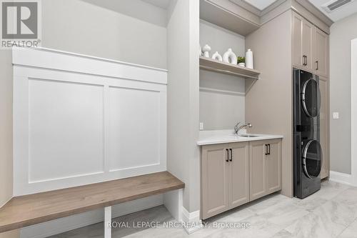 Laundry with custom cabinetry and folding bench - 18 - 190 Canboro Road, Pelham (Fonthill), ON - Indoor Photo Showing Laundry Room