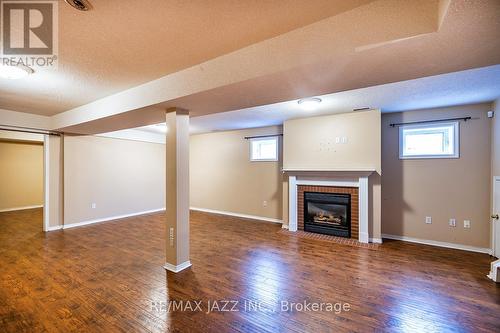 16 Goodwin Avenue, Clarington (Bowmanville), ON - Indoor Photo Showing Basement With Fireplace