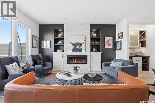 5322 Tutor Way, Regina, SK - Indoor Photo Showing Living Room With Fireplace
