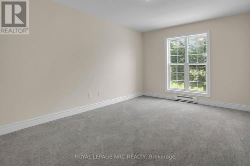 PRIMARY BEDROOM - 56 Queens Circle, Fort Erie (Crystal Beach), ON - Indoor Photo Showing Other Room