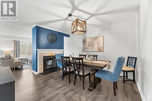 E12 - 1665 Nash Road, Clarington (Courtice), ON - Indoor Photo Showing Dining Room With Fireplace