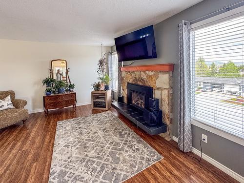 2001 7Th Street, Cranbrook, BC - Indoor Photo Showing Living Room With Fireplace
