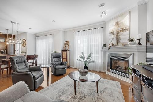 Salon - 203-645 Rue Montmartre, Mascouche, QC - Indoor Photo Showing Living Room With Fireplace