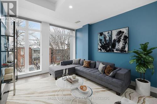 This photo has been virtually staged - 104 Holmwood Avenue, Ottawa, ON - Indoor Photo Showing Living Room