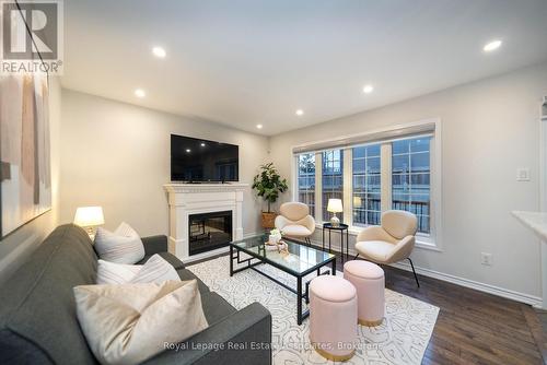 303 Chuchmach Close, Milton, ON - Indoor Photo Showing Living Room With Fireplace